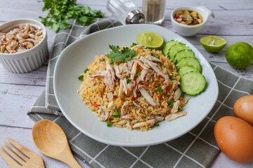 Crab Fried Rice with cucumber and lime on white plate , home made