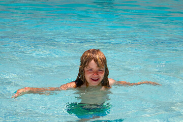 Child in swimming pool. Healthy outdoor sport activity for children. Kids beach fun.