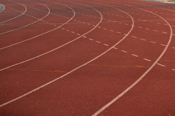Fototapeta premium A track with white lines and red background