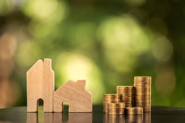 Home model and stack gold coin with growing the interest in the public park, Savings money for buy...