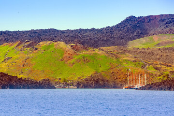 Ships at small port on volcano of Santorini, Greece