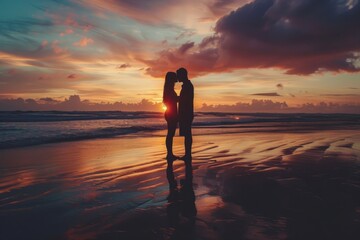 Silhouette of couple on the beach at sunset
