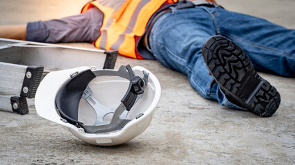 Accident and injury on a construction site. Safety first concept. Male worker lying down...