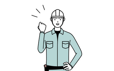 ガッツポーズをするヘルメットと作業着姿の男性