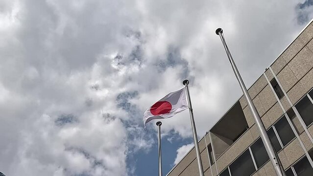 National Flag Of Japan Flying On A Windy Day - Japanese Flag. - low angle shot
