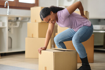 Black tenant moving house suffering backache lifting box