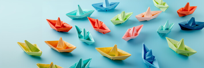 Fototapeta premium Set Of Colorful Origami Boats On A Blue Background, travel concept, touristic travel, summer concept