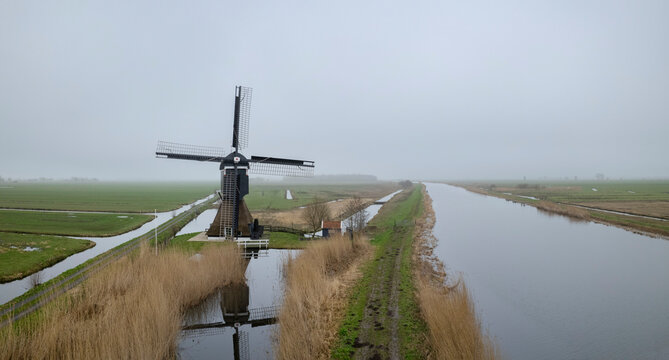 Netherlands, South Holland, Aerial panorama of Alblasserwaard polder during foggy weather