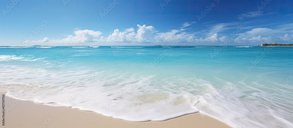 Aufkleber Scenic view of a crystal clear beach with a blue sky, showcasing a tranquil setting perfect for a copy space image.