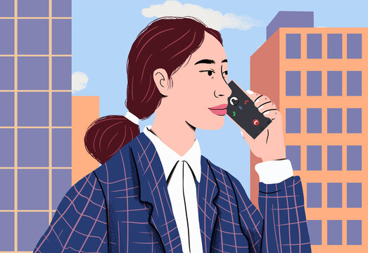 Businesswoman talking on smart phone in front of office buildings