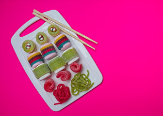 Various jelly strips, candies and marshmallows arranged to look like sushi