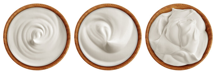 Sour Cream in wooden bowl, Mayonnaise, Yogurt, isolated on white background, full depth of field
