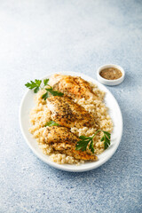 Baked chicken fillet with quinoa and herbs