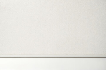 White Textured Wall with Baseboard