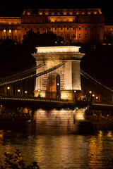 Szechenyi suspension bridge pillar at night. Danube chain bridge in the capital city of Hungary,...