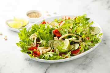 Healthy squid salad with pepper and cucumber