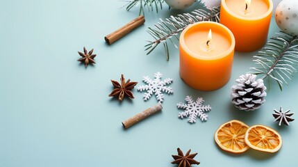 Christmas decoration with candle baubles cinnamon anise fir tree on blue background, orange blue background snowflake