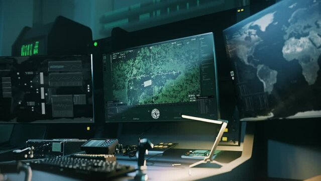 Army forces operating the remote rocket launcher from a control room. Controlling the modern rocket weapon program searching for enemy army vehicles. Controlling rocket launcher and shooting army tank