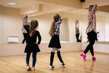 Children Learning Dance in Studio with Instructor Leading The Class