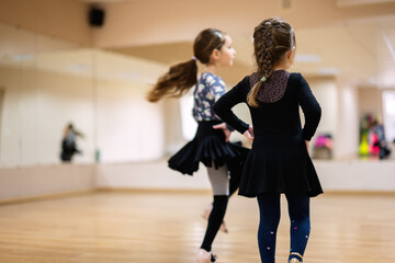 Children Dancing in Ballet Studio with Wooden Floor and Mirrors