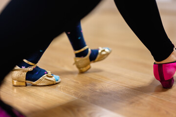 Close-Up of Tap Dance Shoes on Wooden Floor in Dance Studio - Powered by Adobe