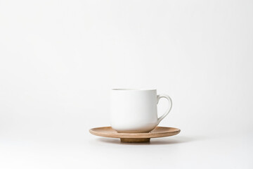 White Mug on Wooden Saucer