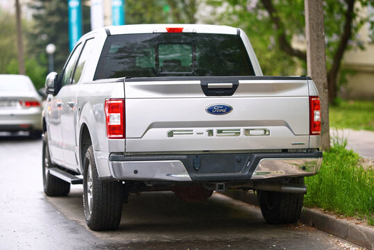 Minsk, Belarus. May 10, 2024. Ford truck F-150 XLT  parked on city street at roadside, rear body exterior design. View on taillights and big trunk. Street parking for large vehicles