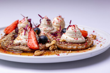 Gourmet Pancakes with Fresh Berries and Whipped Cream