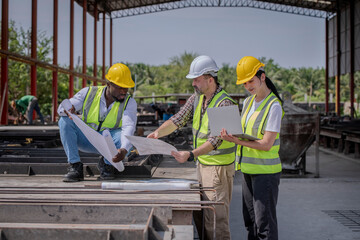 Engineer or foreman worker architecture  safety uniform survey at structure building site blueprint and document check detail and measure of common work is building architecture business concept.