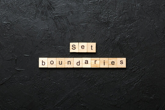set boundaries word written on wood block. set boundaries text on table, concept