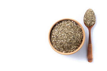 Traditional yerba mate in wooden bowl isolated on white background. Top view. Copy space