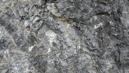 cracked black stone surface texture background.