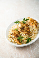 Baked chicken fillet with quinoa and herbs