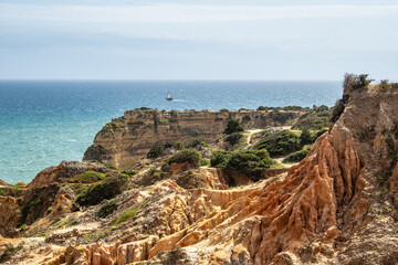 Praia da Marinha Beach among rock islets and cliffs seen from Seven Hanging Valleys Trail, Algarve,...