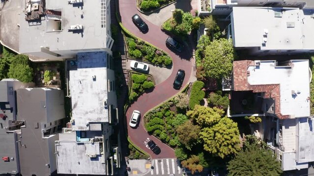 Rising bird's eye aerial shot of crooked Lombard Street on Russian Hill in San Francisco, California. 4K