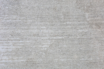 A grey concrete wall with a rough texture