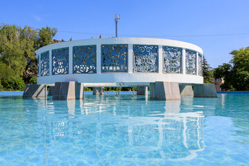A large white pool with blue sky in the background