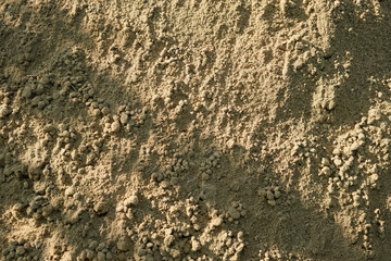 Background of brown sandy powder. Background Texture, Copy Space, Grey sand Background with abstract texture with shadows.