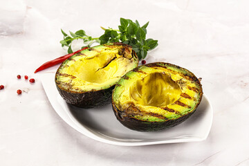Sliced fresh avocado on the grill
