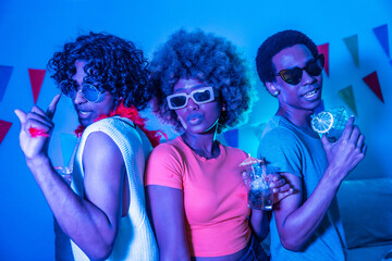 African woman and two latin men partying at home