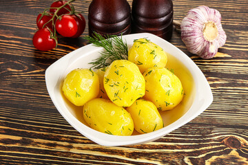 Boiled potato with oil and dill