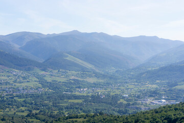 Naklejka premium Landscape with morning fog, plains and mountains