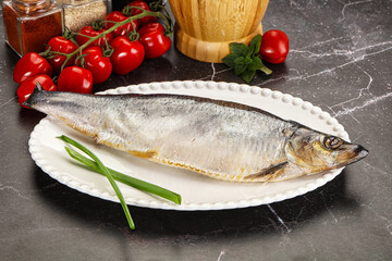 Whole raw salted herring fish