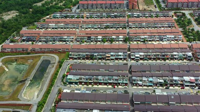 Aerial views from a drone flyover reveal the Goodview Heights residential neighborhood featuring rows of double-storey terraced houses constructed by SHL Consolidated Berhad, Malaysia, Southeast Asia.