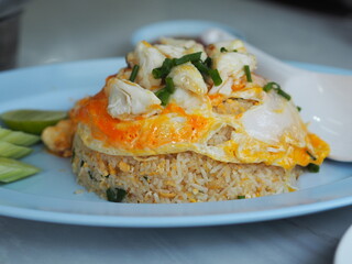 Crab meat fried rice topped with Scrambled egg, style Thai food
