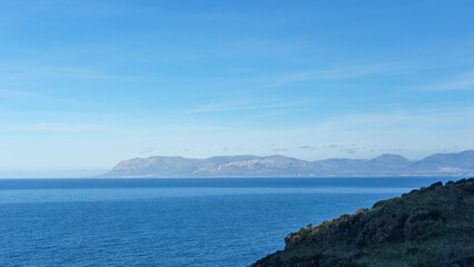 Fototapeta premium Famous natural reserve Riserva Naturale Orientata dello Zingaro with view over the bay to mountains at the coastline, San Vito Lo Capo, Sicily, Italy