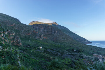 Coastline of famous natural reserve Riserva Naturale Orientata dello Zingaro with mountain range, San Vito Lo Capo, Sicily, Italy