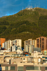 Modern apartment buildings at sunrise, Pichincha volcano, Quito, Ecuador.