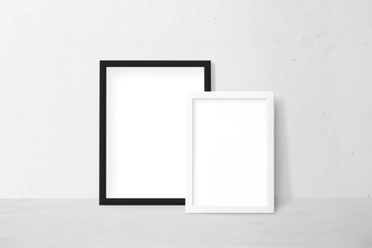 Black and white picture frame mockup leaning against a white wall