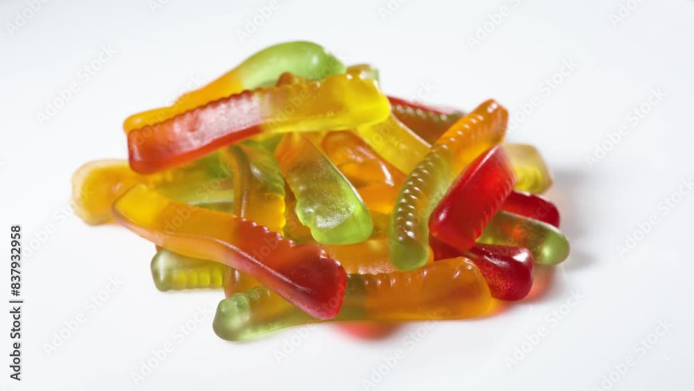 Sticker Heap of jelly worms close-up on a white background.